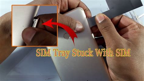 clean large debris jammed into smart card slot|Troubleshooting: Fixing a Stuck SIM Car.